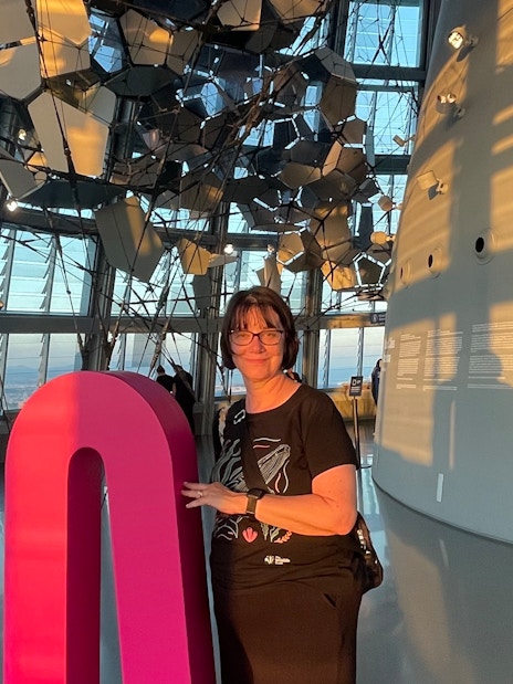 Tourist inside Glories Skyline Tower with modern architecture and city view.