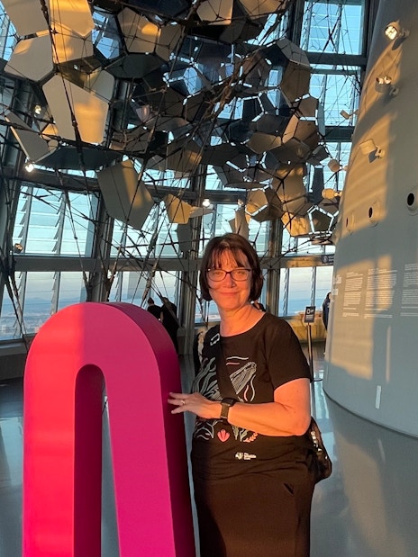 Tourist inside Glories Skyline Tower with modern architecture and city view.