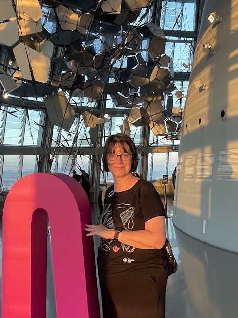 Tourist inside Glories Skyline Tower with modern architecture and city view.