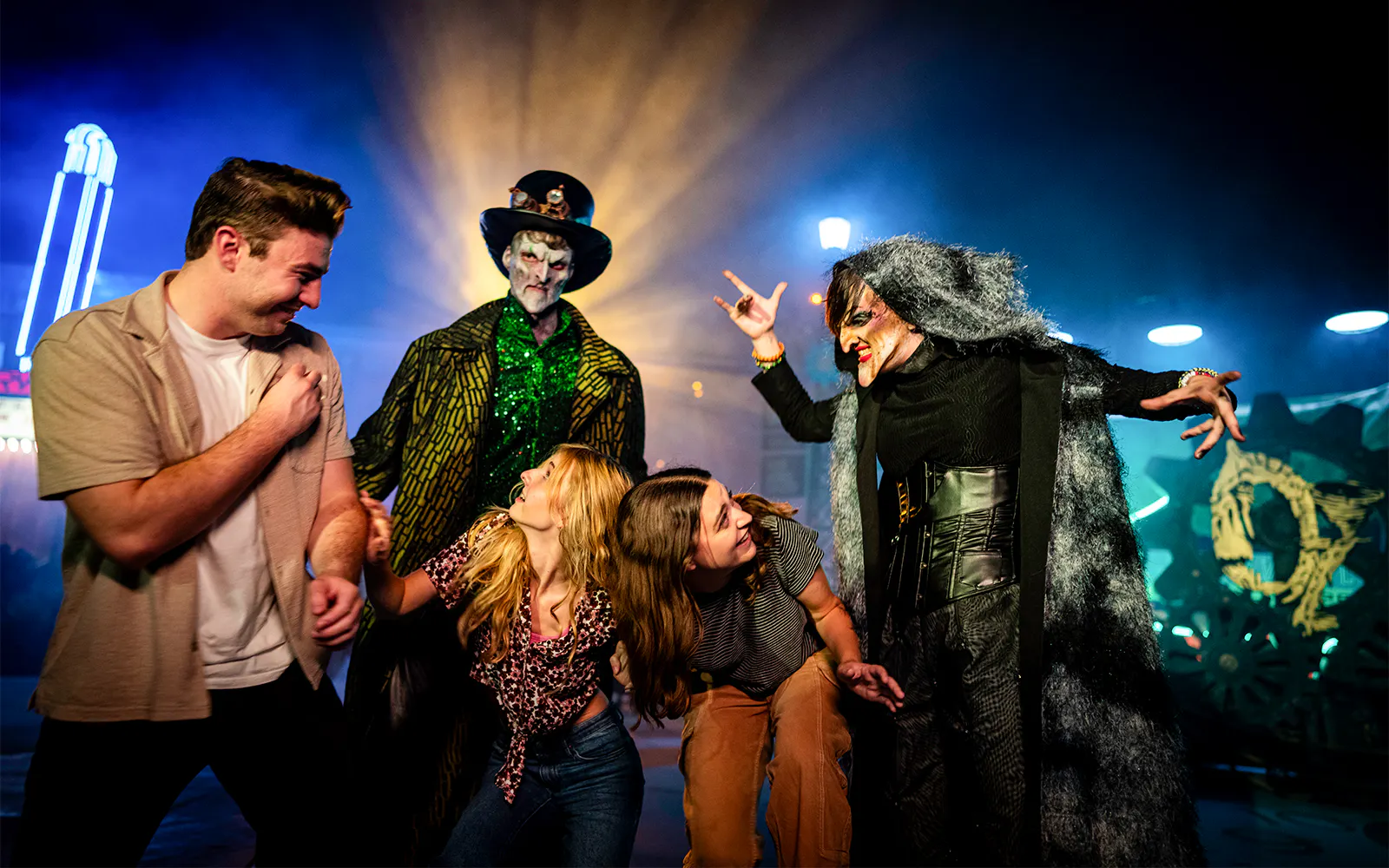 Guests interacting with costumed performers at Six Flags SCarowinds Snicker's Halloween Event.
