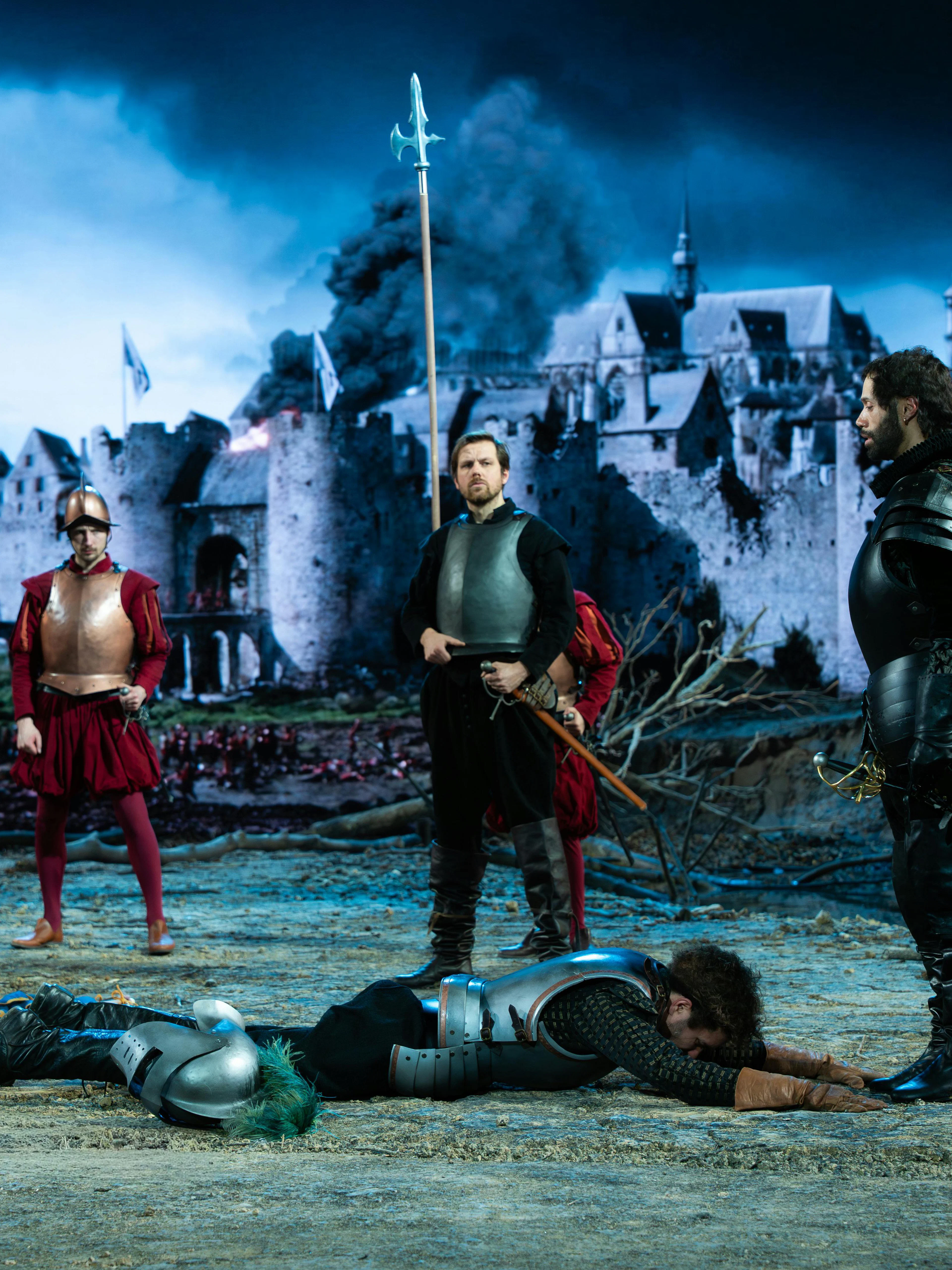 Medieval reenactment with soldiers and castle backdrop, Willem van Oranje theme.
