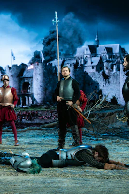 Medieval reenactment with soldiers and castle backdrop, Willem van Oranje theme.