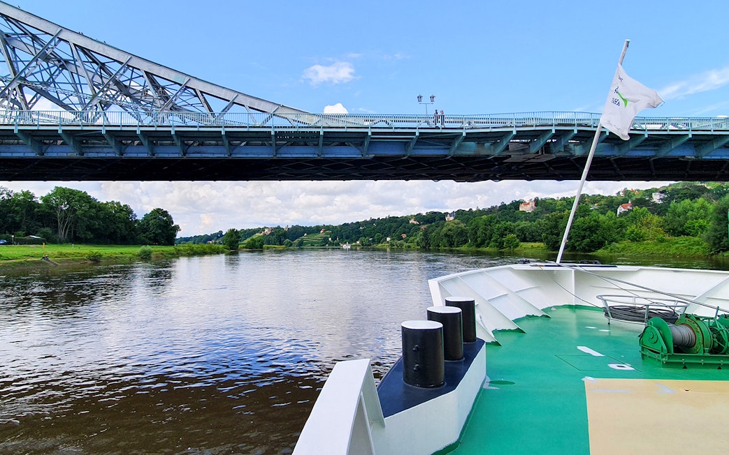 Elbe River cruise passing under Blue Wonder Bridge in Dresden.
