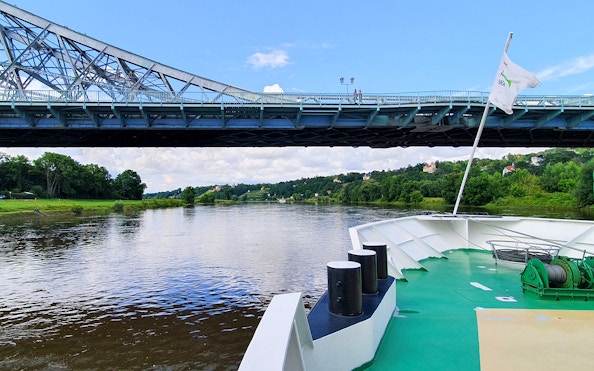 Elbe River cruise passing under Blue Wonder Bridge in Dresden.