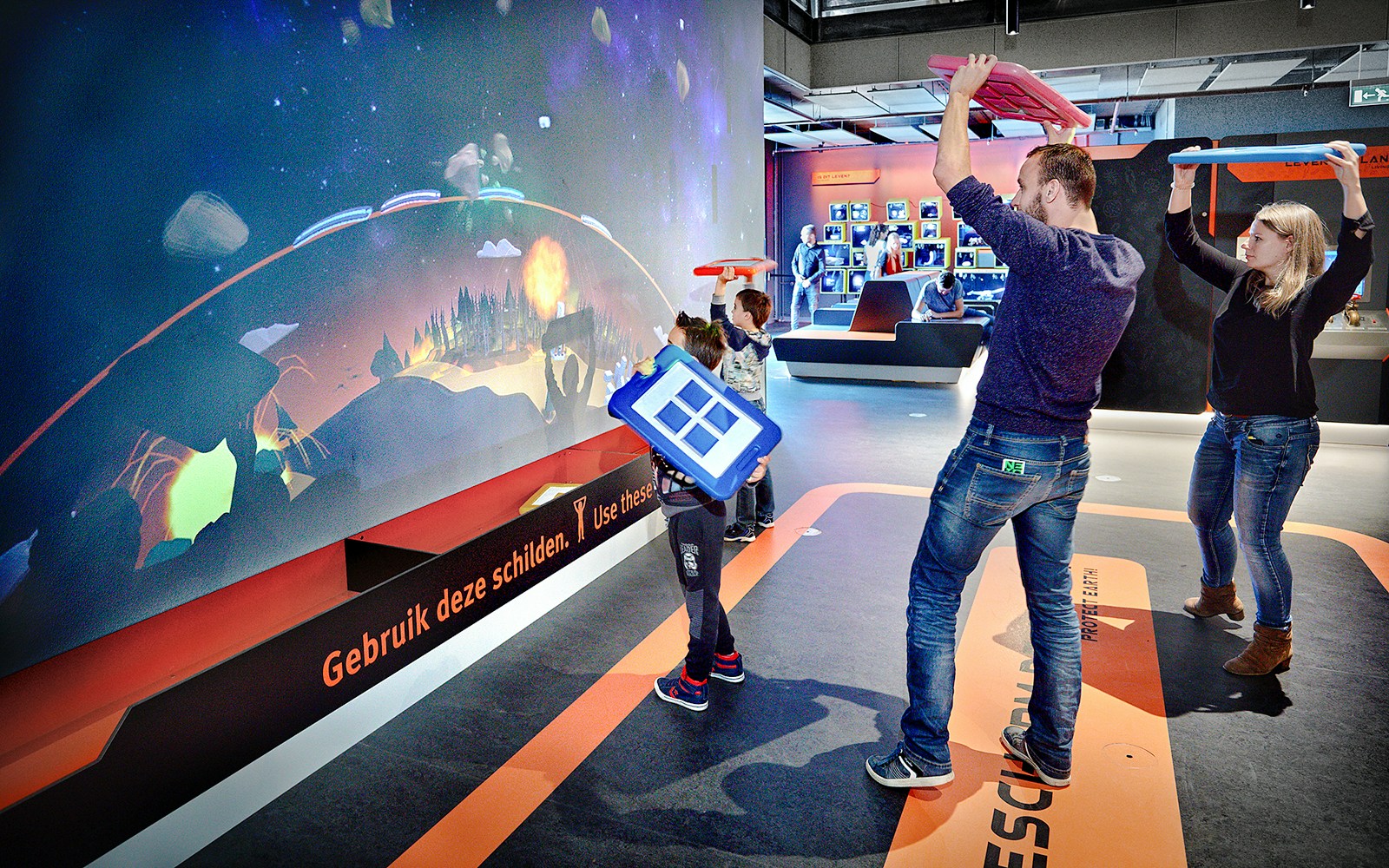 Visitors engaging with interactive exhibit at NEMO Museum Amsterdam.