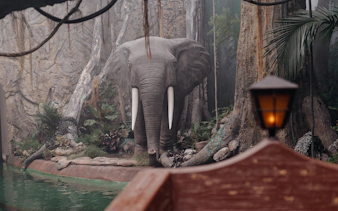 Elephant statue in jungle setting at World of Discoveries Interactive Digital Exhibition.