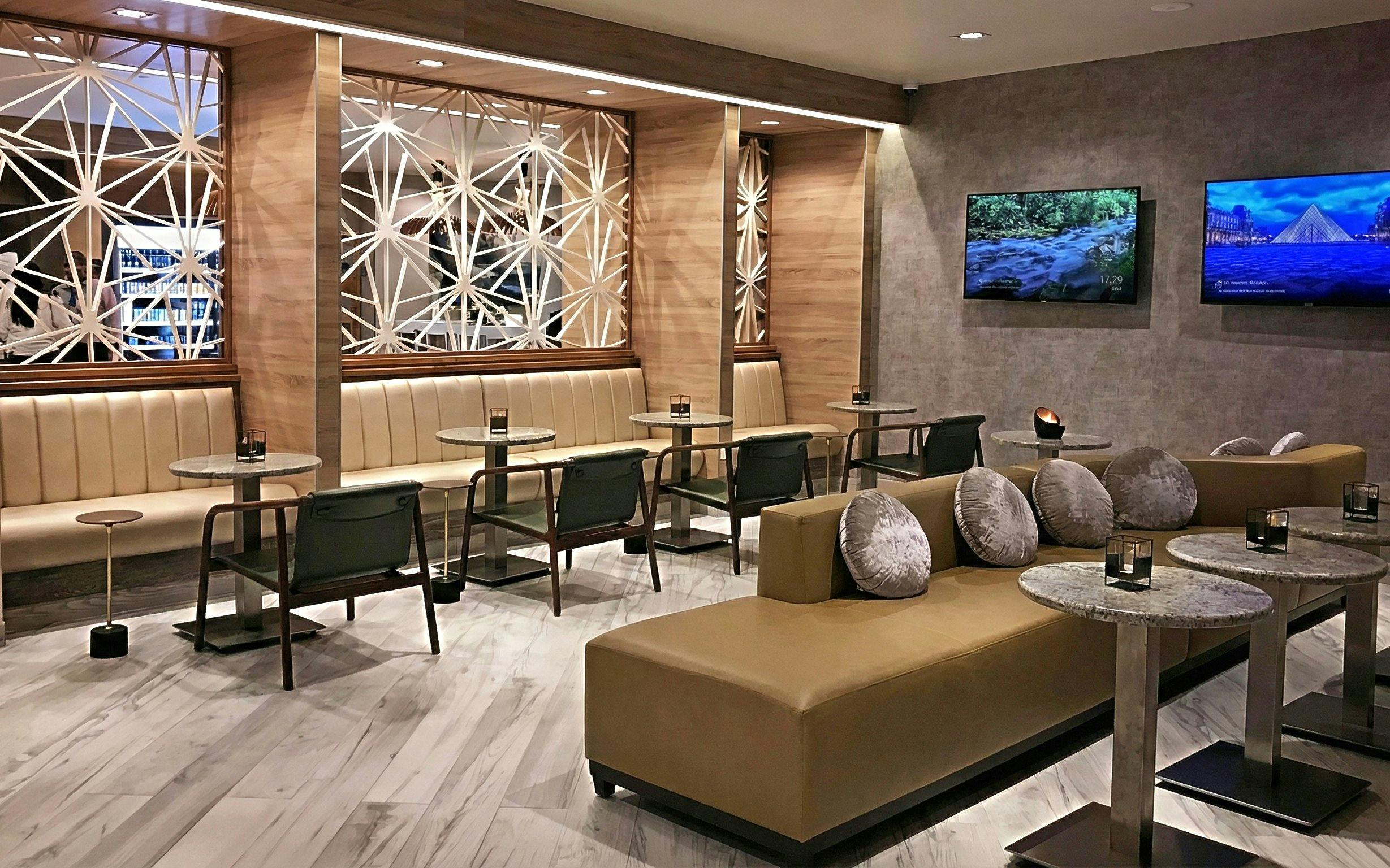 Mera VIP Lounge seating area with modern decor at Cancun International Airport.