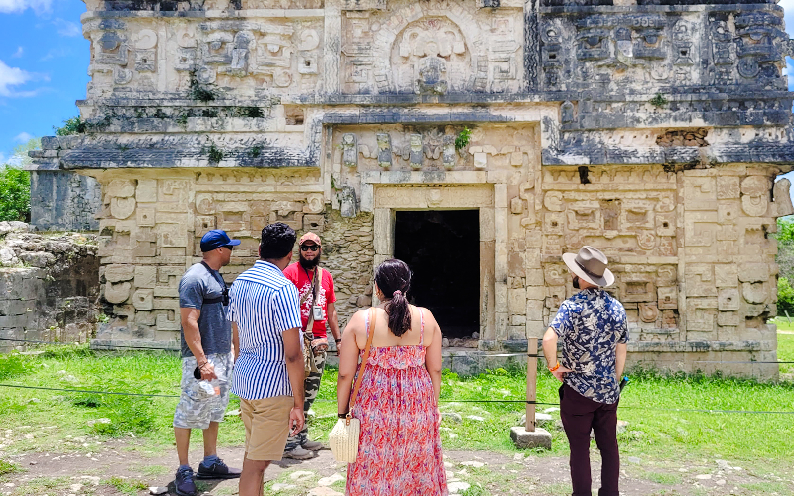 Tourists exploring ancient Mayan ruins at Chichen Itza, Mexico.