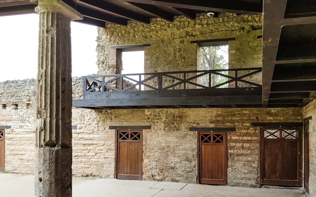 Ancient stone and wood structure at Pompeii ruins, Italy.