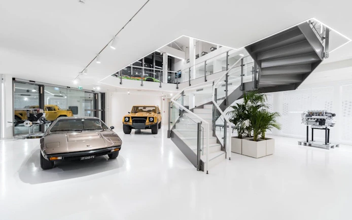 Lamborghini cars and engine display at Automobili Lamborghini Museum, Sant'Agata Bolognese, Italy.