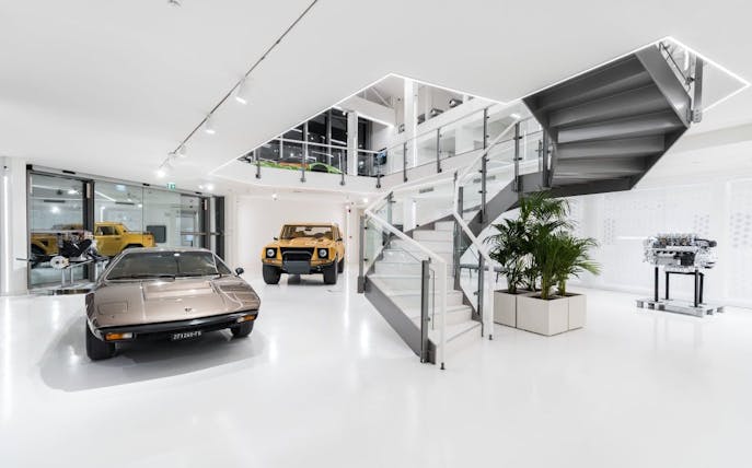Lamborghini cars and engine display at Automobili Lamborghini Museum, Sant'Agata Bolognese, Italy.