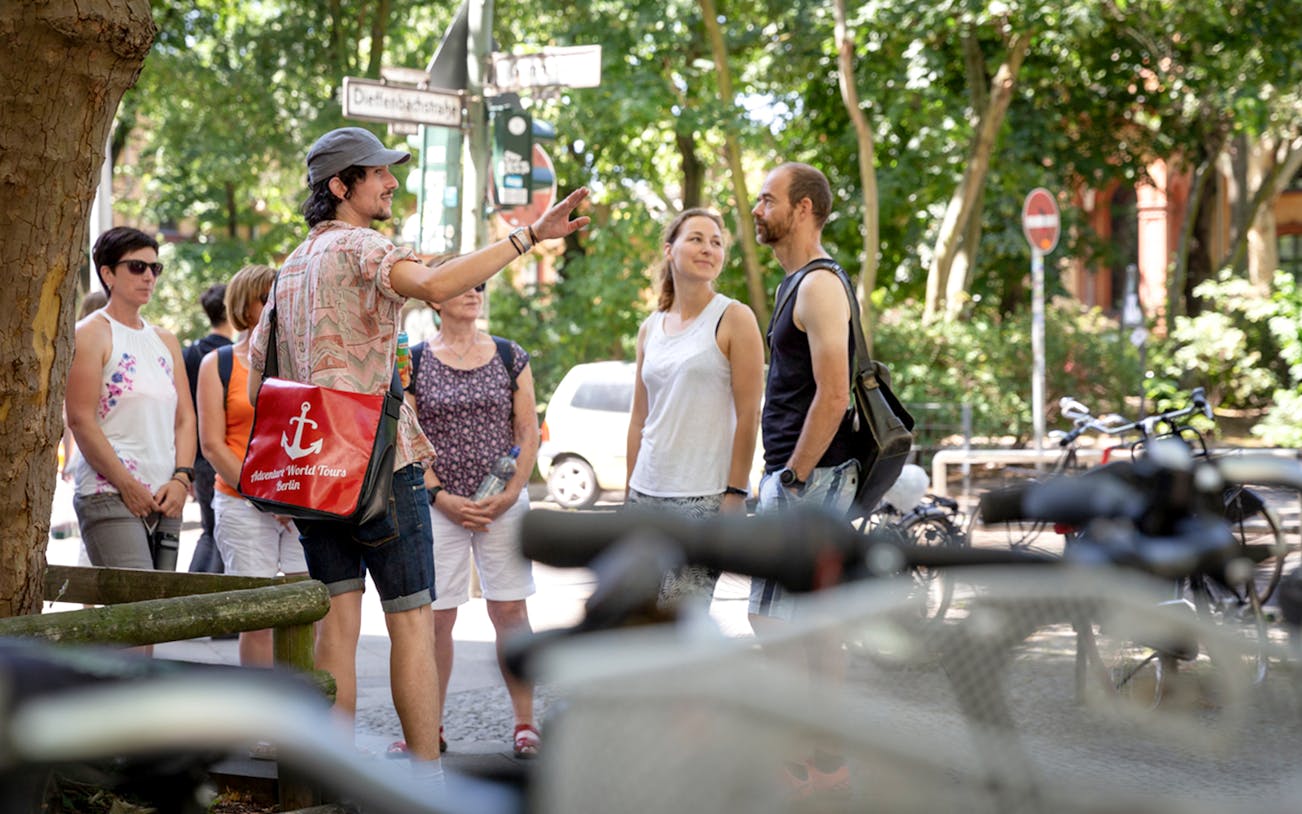Tour guide leading a group on a Kreuzberg food tour in Berlin.