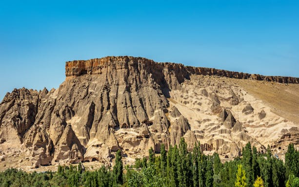 Panoramic view of Ihlara Valley's rock formations and greenery, Cappadocia, Turkey.