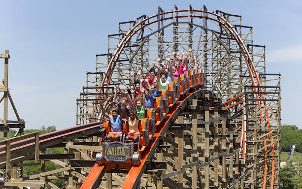 Roller coaster with riders at Six Flags Great America.