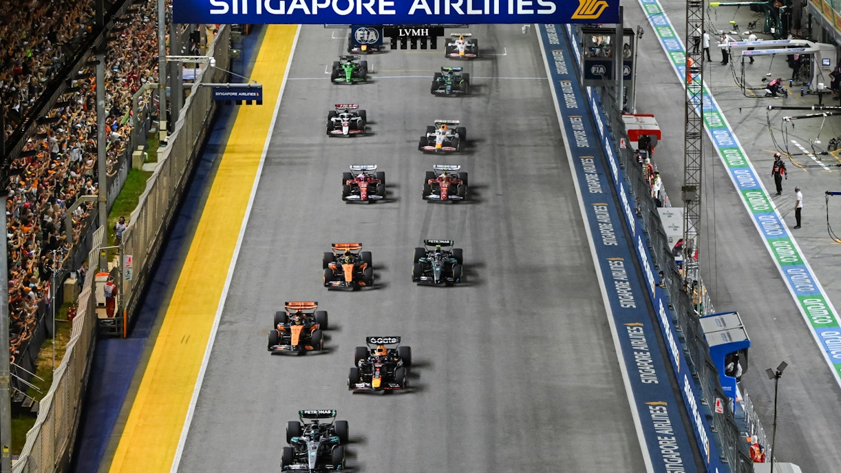 Cars racing down the Pit Straight at Singapore Grand Prix.