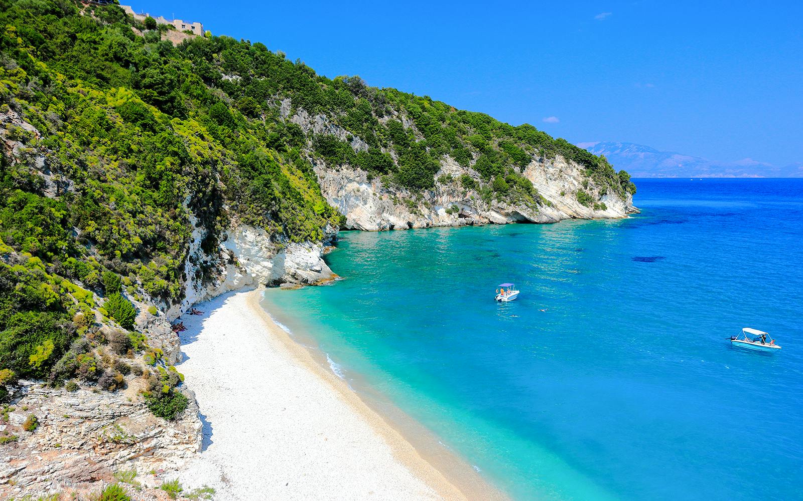 Xigia beach on Zakynthos Island with turquoise waters and boats near the shore.