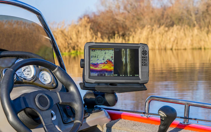 Boat dashboard with sonar display on Loch Ness cruise.