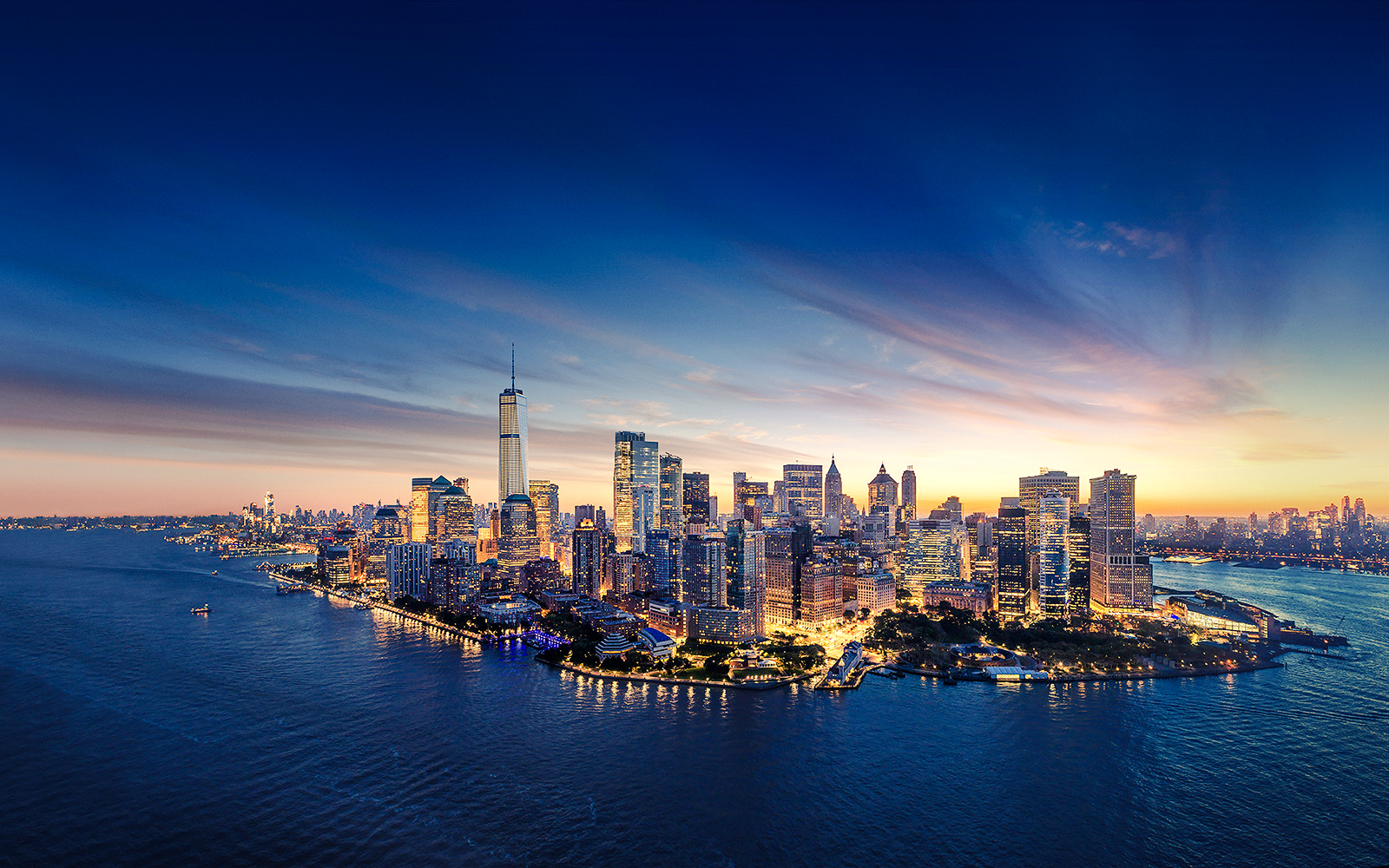 Aerial view of Manhattan skyline at sunset with One World Observatory in New York City.