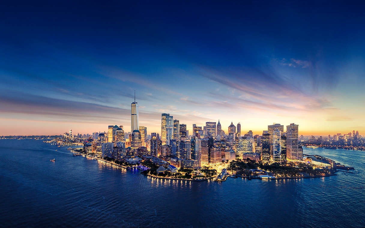 Aerial view of Manhattan skyline at sunset with One World Observatory in New York City.