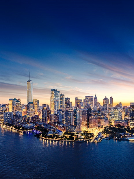 Aerial view of Manhattan skyline at sunset with One World Observatory in New York City.