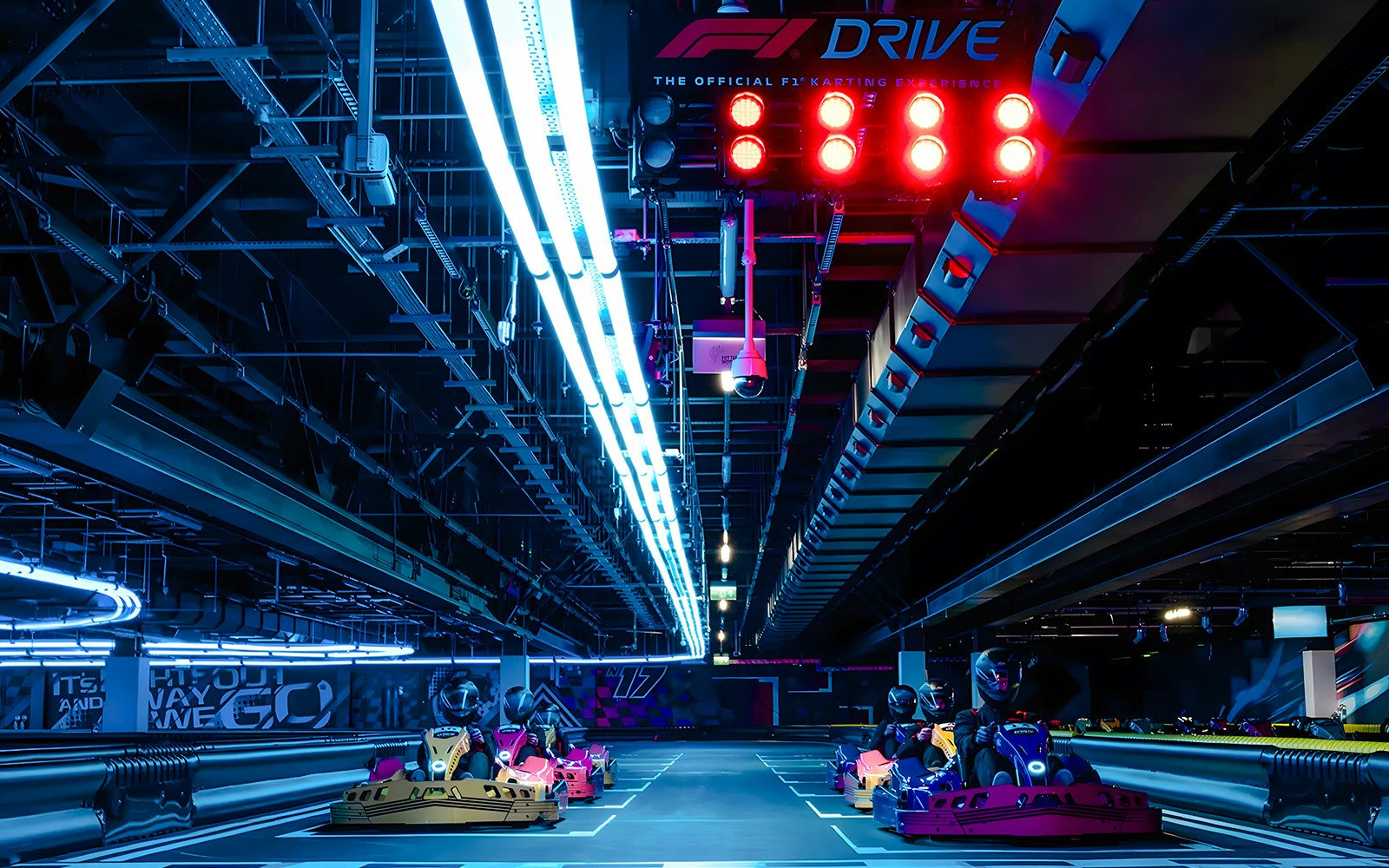 Guests driving go-karts at the Elite F1 Drive experience in London.