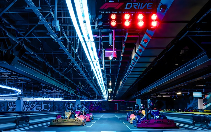 Guests driving go-karts at the Elite F1 Drive experience in London.