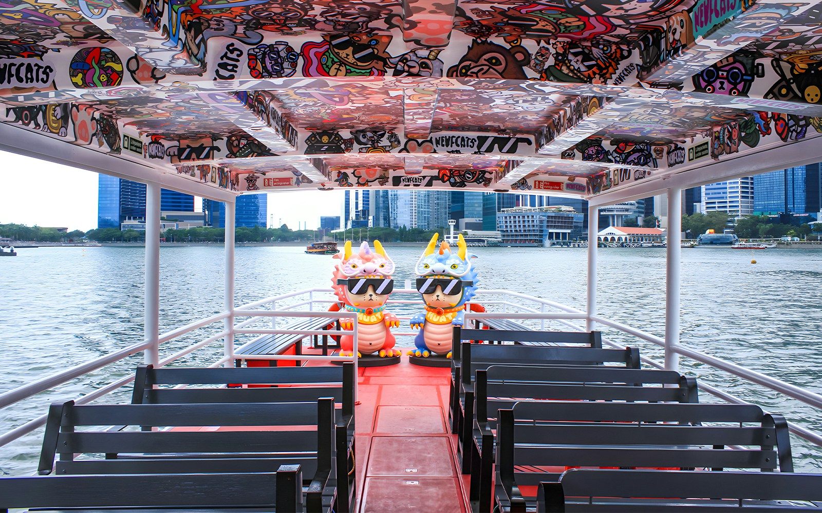 Boat cruising along Singapore River with city skyline in the background, Singapore River Cruise by WaterB.