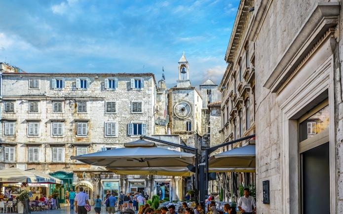 People's Square in Split, Croatia, featuring historic buildings and a clock tower.