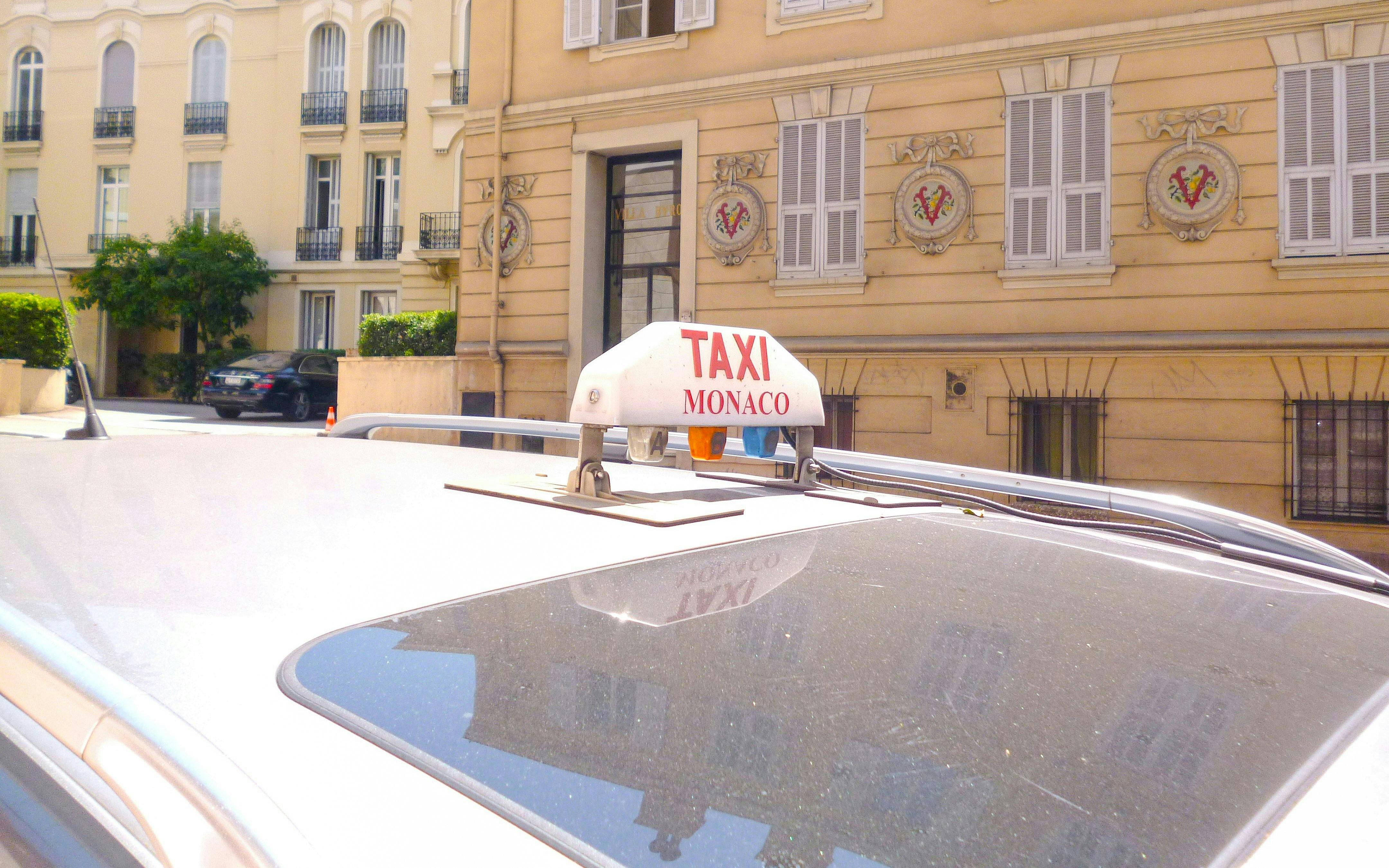 Monaco taxi near Oceanographic Museum building.