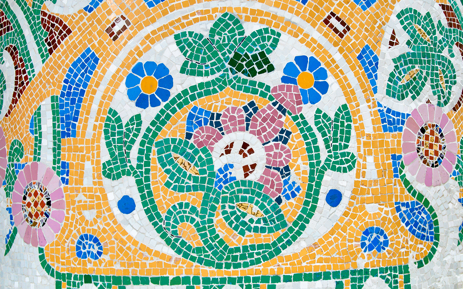 Mosaic tiles at Park Güell, Barcelona, showcasing Gaudí's iconic architectural style.