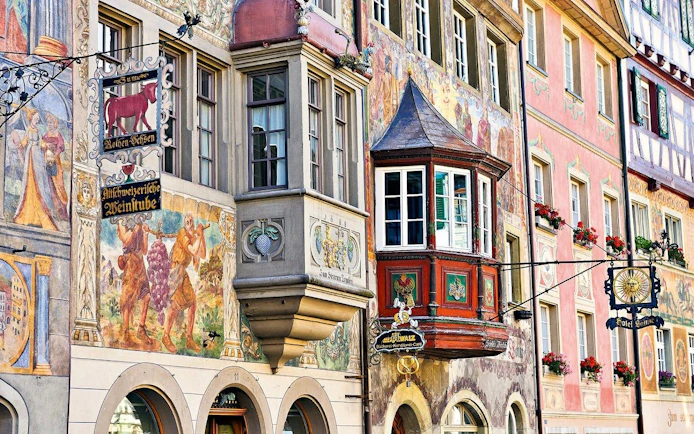 Stein am Rhein old town buildings with detailed frescoes and bay windows.