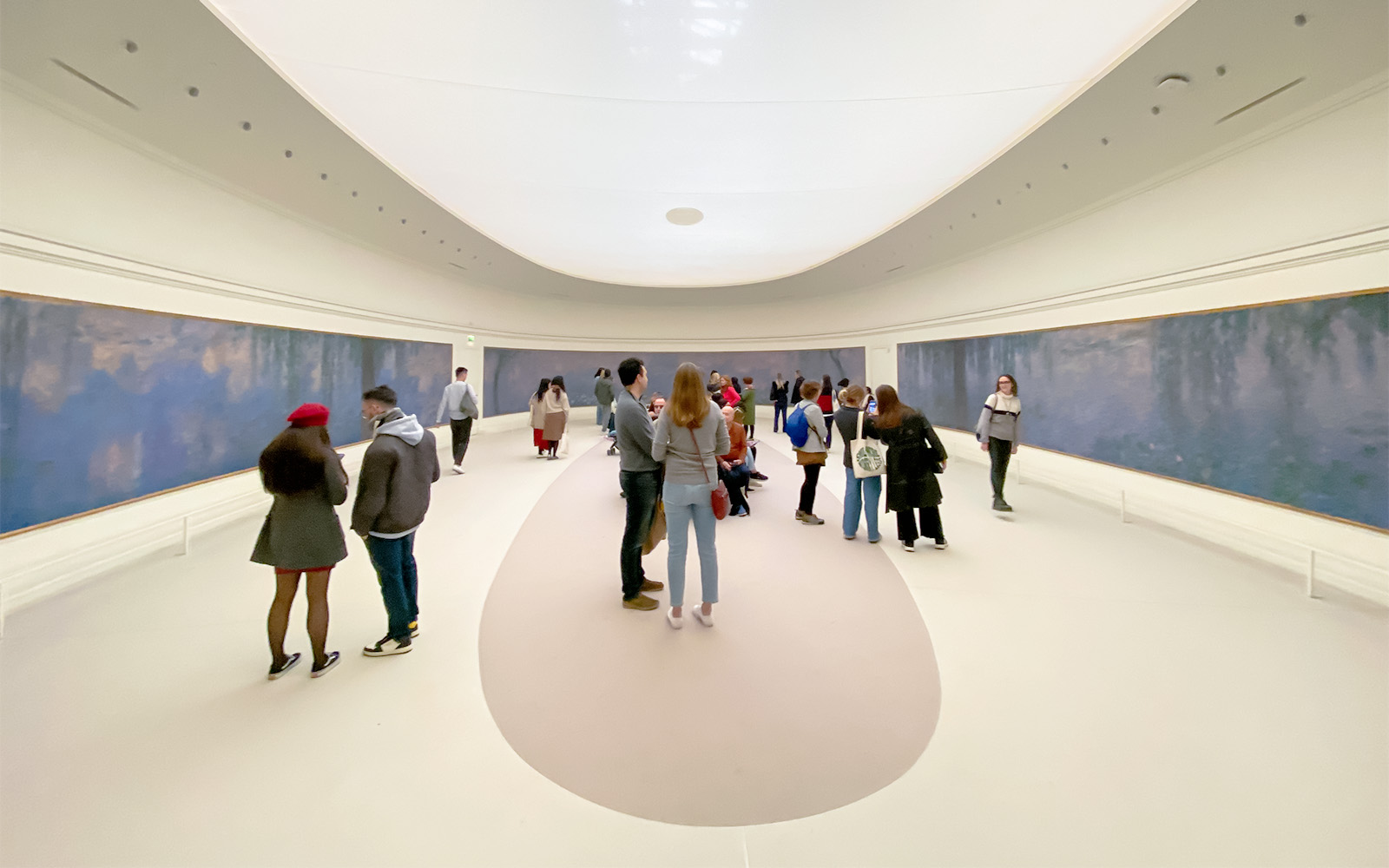 Orangerie Museum interior with visitors entering, Paris, France.