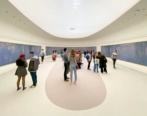 Orangerie Museum interior with visitors entering, Paris, France.