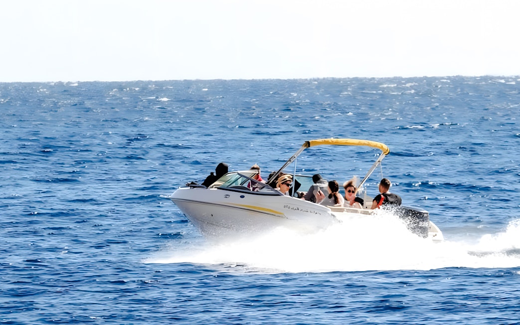 Tourists enjoying a private speedboat ride to Tiran Island.