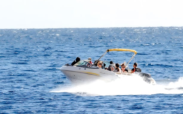 Tourists enjoying a private speedboat ride to Tiran Island.