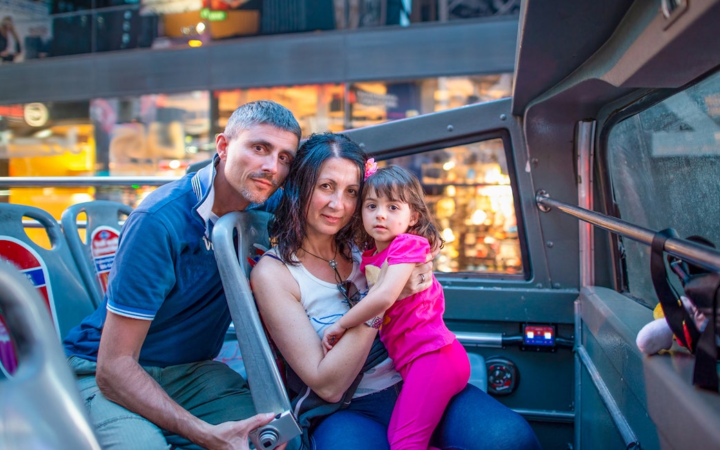Family enjoying Big Bus Miami Panoramic Night Tour.