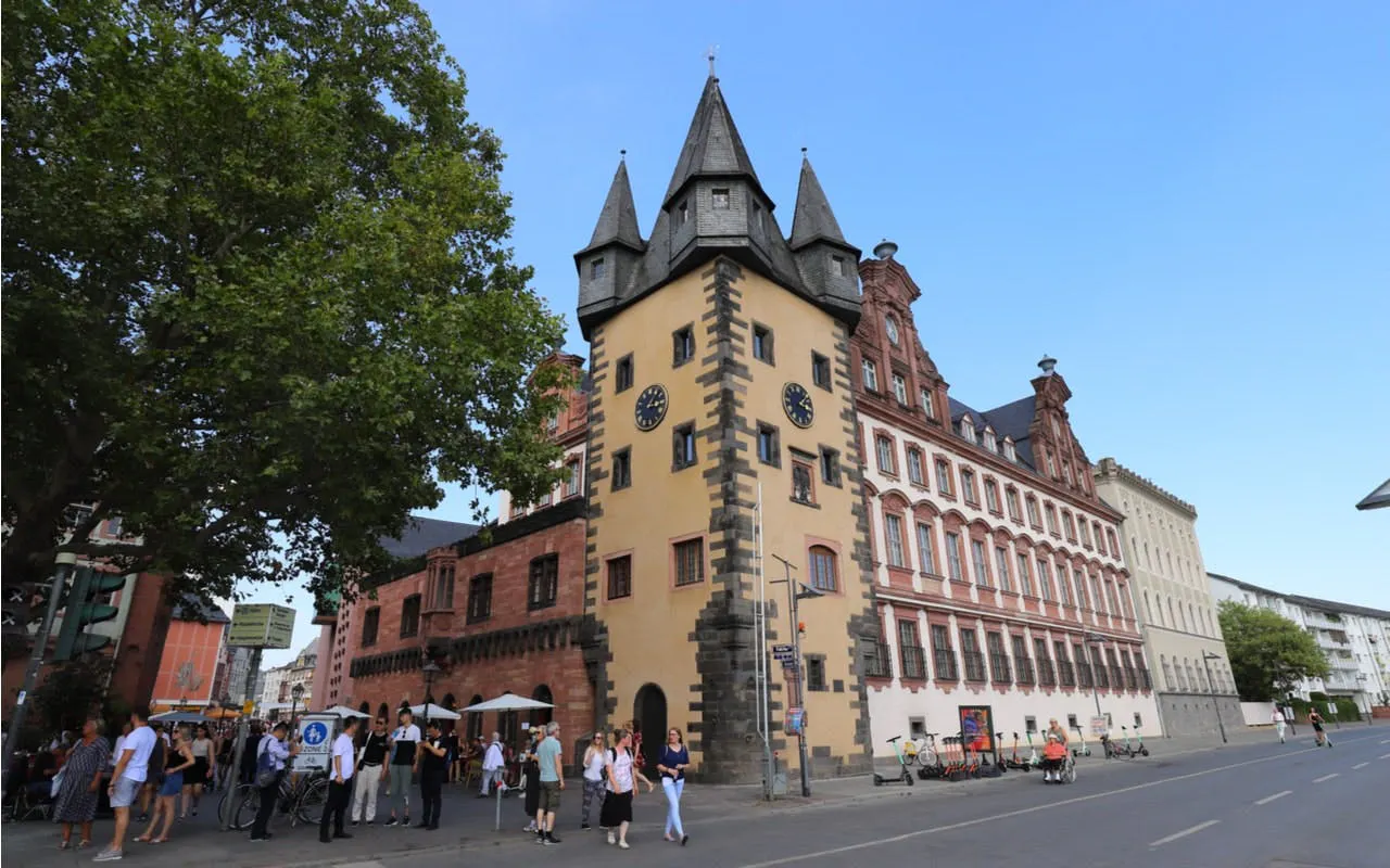 Old Town Frankfurt tower with people exploring the street.
