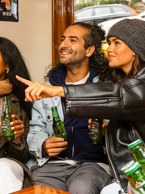 Guests enjoying Heineken on a canal cruise in Amsterdam.