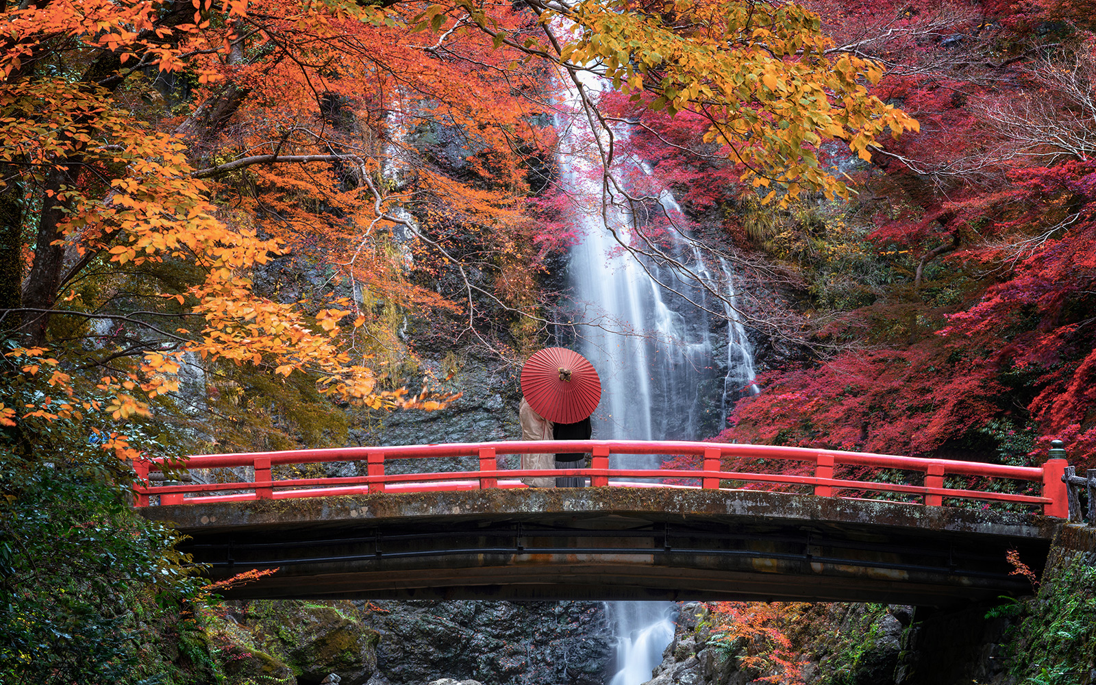 Red bridge and waterfall in autumn foliage, Kansai, Japan, JR-West Kansai Rail Pass.