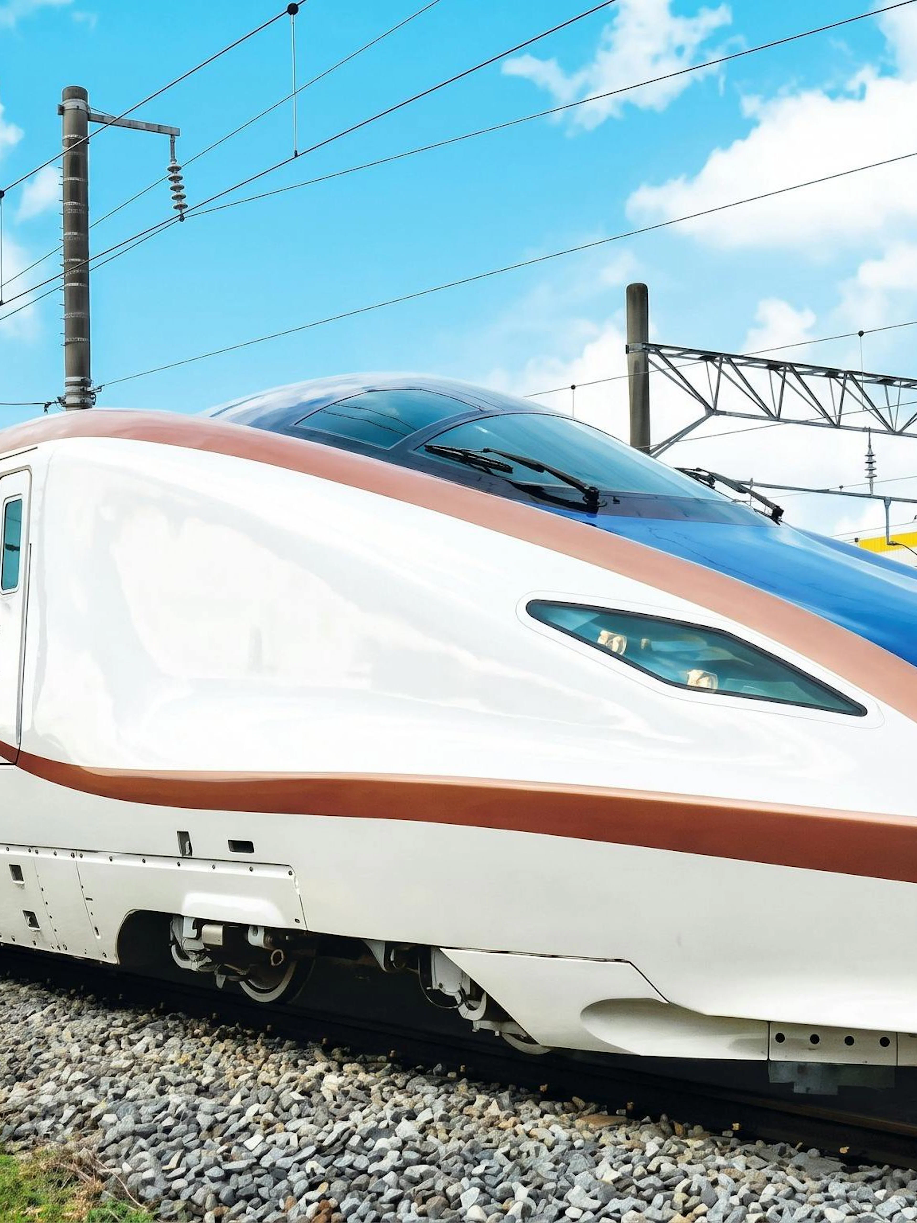 High-speed train on tracks, JR Hokuriku Arch Pass route, Japan.