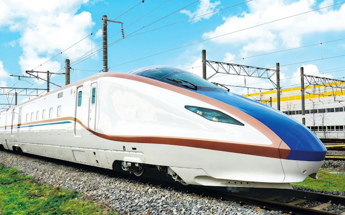 High-speed train on tracks, JR Hokuriku Arch Pass route, Japan.