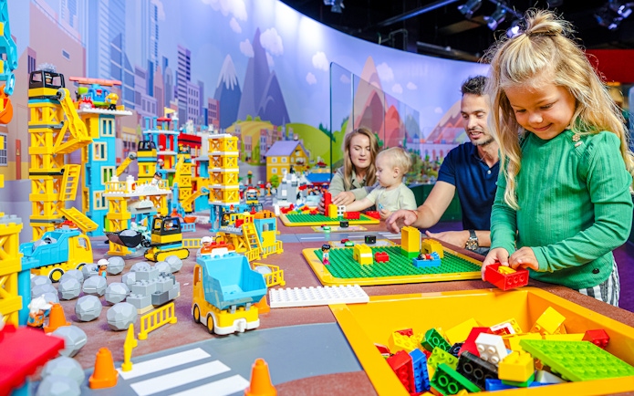 Kids building with LEGO bricks at LEGO Discovery Center Boston.