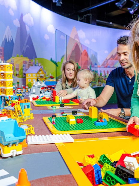 Kids building with LEGO bricks at LEGO Discovery Center Boston.