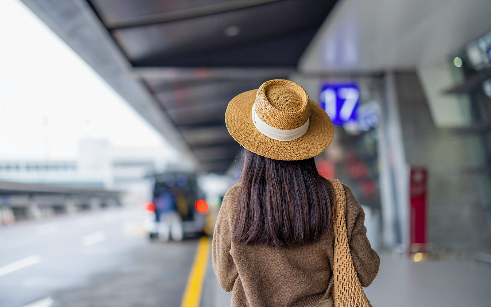 Travel woman wait for the taxi outside airport