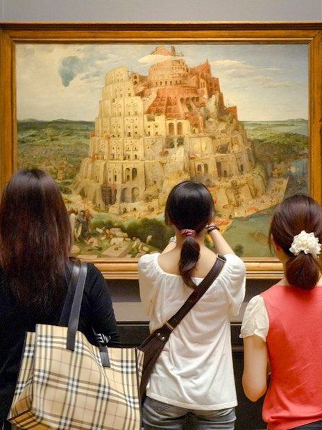 Visitors viewing Brueghel's Tower of Babel painting at Kunsthistorisches Museum.