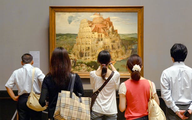 Visitors viewing Brueghel's Tower of Babel painting at Kunsthistorisches Museum.