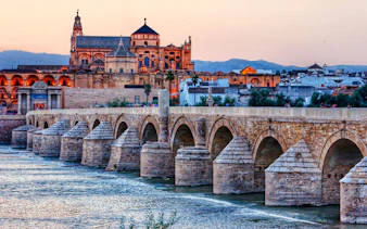 Roman Bridge and Mosque-Cathedral during Córdoba walking tour, Spain.