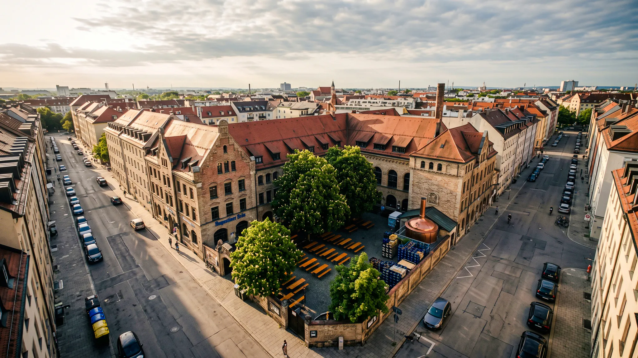 Aerial view of Munich brewery courtyard with benches, part of Oktoberfest Keg Tapping tour.