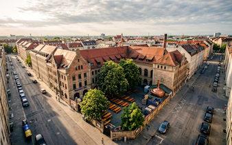Aerial view of Munich brewery courtyard with benches, part of Oktoberfest Keg Tapping tour.
