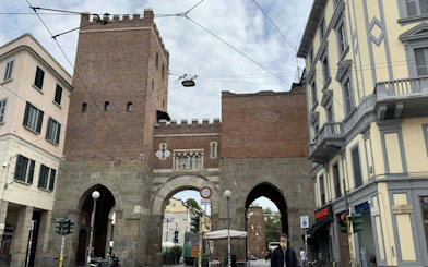 Historic Porta Ticinese gate in Milan, part of the Navigli self-guided city exploration game.